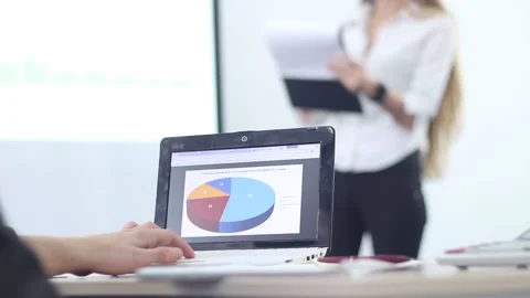 Businessman uses a laptop at the presentation Stock Footage 87085853