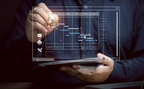 Businessman uses pointer pen on work schedule to make decisions at virtual .. Stock Photos