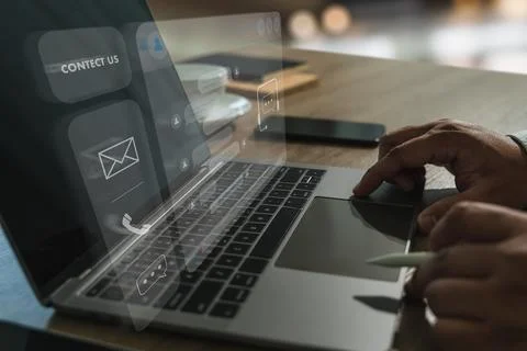 Businessman using AI chatbot interface on laptop for digital contact center.. Stock Photos