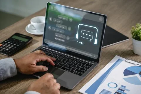 Businessman using AI chatbot interface on laptop for digital contact center.. Foto stock