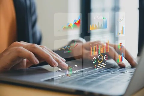 Businessman using analytics data KPI dashboard tech on virtual screen. Stock Photos