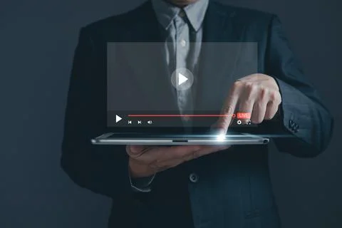Businessman is using and touching tablet screen in broadcasting, digital te.. Stock Photos