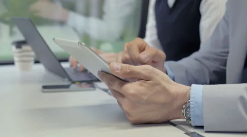 Businessman using an app on a white tablet Stock Footage 67261996