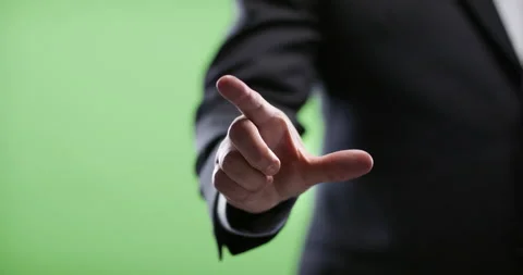 Businessman using Augmented reality touch display. Shot on green screen in 4k. Stock Footage 131570071