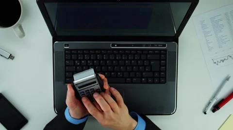Businessman using calculator Stock Footage 60744480