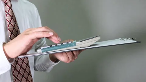 A businessman using a calculator Stock Footage 336590083