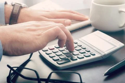 Businessman using a calculator Stock Photos