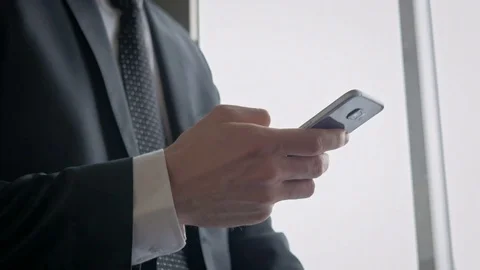 Businessman using a cell phone in the elevator Stock Footage 75551815
