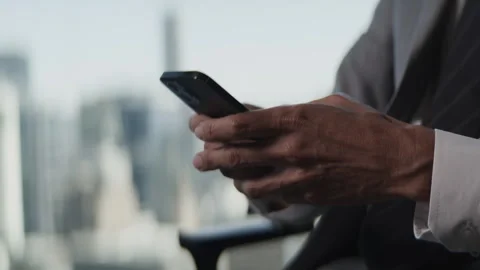 Businessman using Cellphone for Texting Stock Footage 262534743