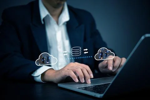 Businessman using cloud computing technology for data transfer and storage... Stock Photos