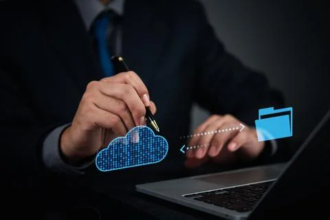 Businessman using cloud technology to transfer files to secure digital stor.. Stock Photos