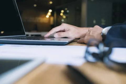 Businessman using computer to analyse data. Stock Photos