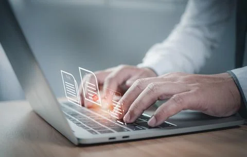 Businessman using a computer to complete Individual income tax return form .. Stock Photos