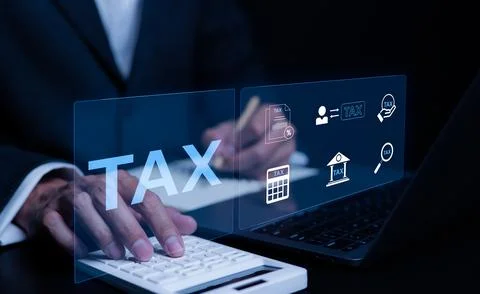 Businessman using a computer to complete Individual income tax return. Stock Photos