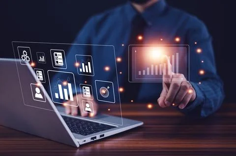 Businessman using computer data management and paperless document control a.. Stock Photos