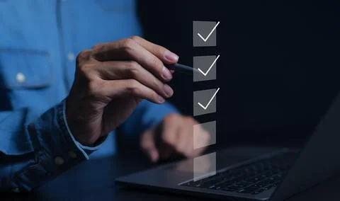 Businessman using computer doing online checklist survey. Stock Photos