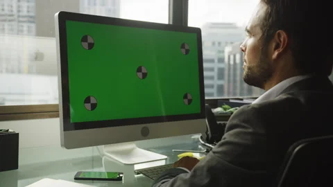 Businessman using a computer with green screen Stock Footage 264249527