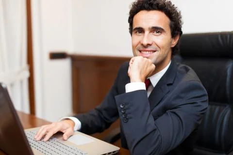 Businessman using a computer in his office Stock Photos
