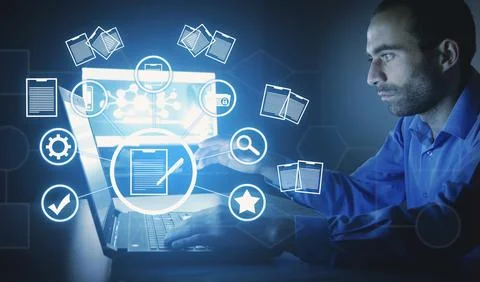 Businessman using a computer keyboard. Online documentation database Stock Photos