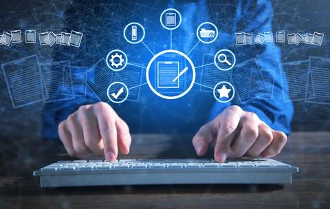 Businessman using a computer keyboard. Online documentation database Stock Photos