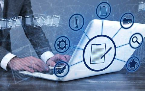 Businessman using a computer keyboard. Online documentation database Stock Photos