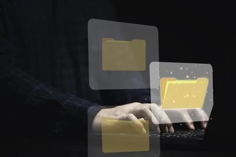 Businessman using computer laptop with virtual folder graphic for online do.. Stock Photos