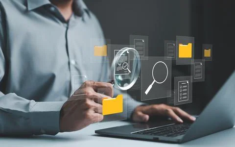 Businessman using computer to manage document files in folders. folder file. Stock Photos