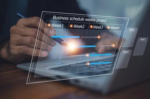 Businessman using computer for project business schedule by weekly, Busines.. Stock Photos