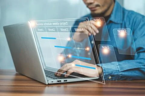 Businessman using computer for project business schedule by weekly, Busines.. Stock Photos