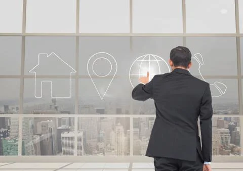 Businessman using contact icon interface in office Stock Photos