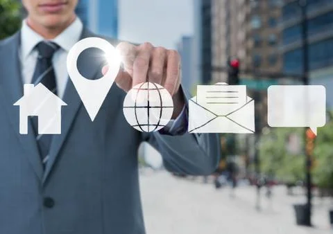 Businessman using contact icon interface on street Stock Photos