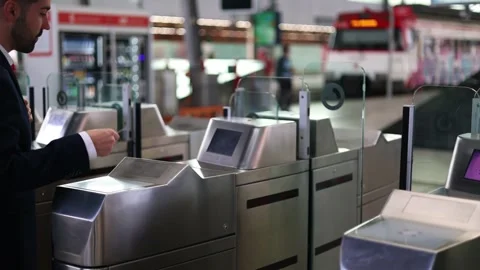 Businessman using contactless card at train gate on the way to platform for.. Stock Footage 293483381
