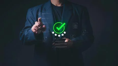 Businessman using digital checkmark and rating icons Stock Photos