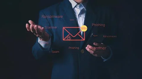 Businessman using digital email security symbols in dark Stock Photos