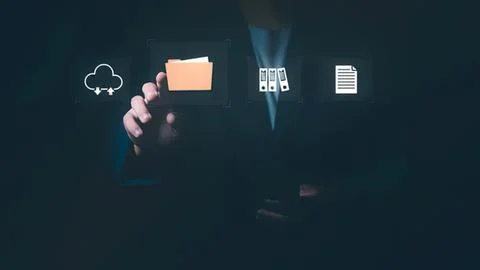 Businessman using digital icons for cloud storage and files Stock Photos