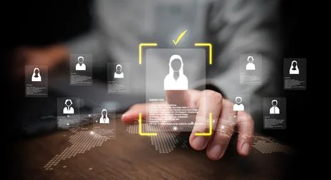 Businessman using digital interface to select female candidate with profile.. Stock Photos