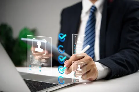 Businessman using digital interface to select candidates with virtual profi.. Stock Photos