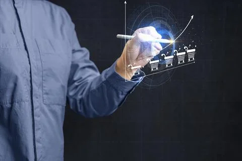 A businessman using a digital stylus to draw a rising growth graph with sho.. Stock Photos