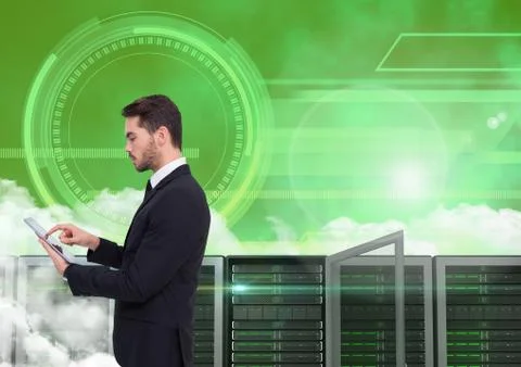 Businessman using digital tablet against server room Stock Photos