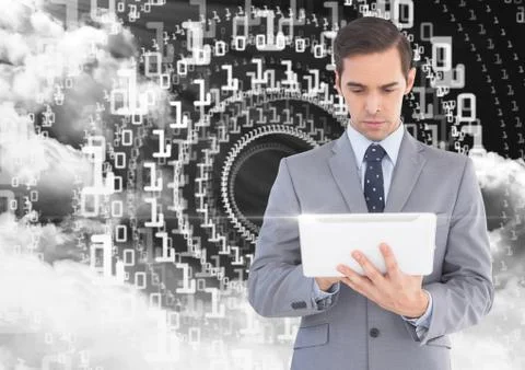Businessman using digital tablet with binary codes and cloud in background Stock Photos