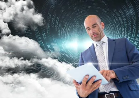 Businessman using digital tablet with binary codes and cloud in background Stock Photos