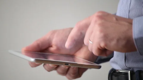 Businessman using digital tablet computer, side view close up Stock Footage 98100075