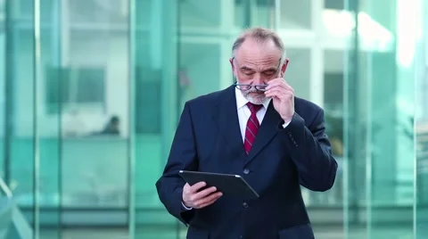 Businessman using a digital tablet Stock Footage 61961676