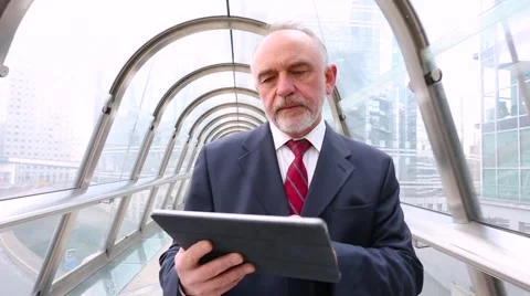 Businessman using a digital tablet Stock Footage 61961690