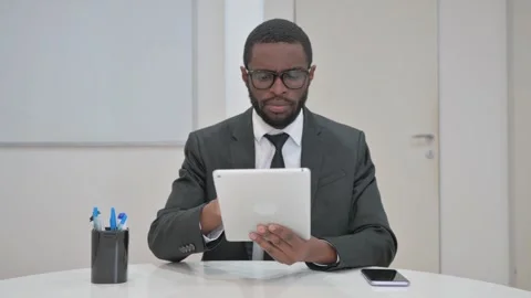 Businessman Using a Digital Tablet Stock Footage 310164600