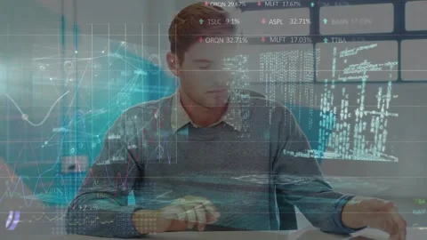 A businessman using a digital tablet to look at documents in an office Stock Footage 327122977