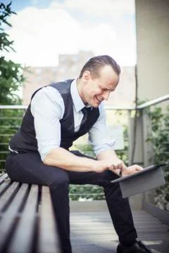 Businessman using digital tablet outdoors Stock Photos