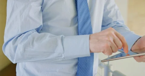 Businessman Using Digital Tablet By Railing At Office 4K Stock Footage 92372087