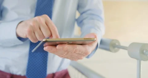 Businessman Using Digital Tablet By Railing At Office 4K Stock Footage 92440008