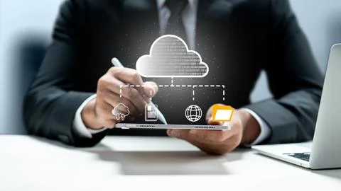 Businessman using a digital tablet with stylus to manage cloud computing an.. Stock Photos